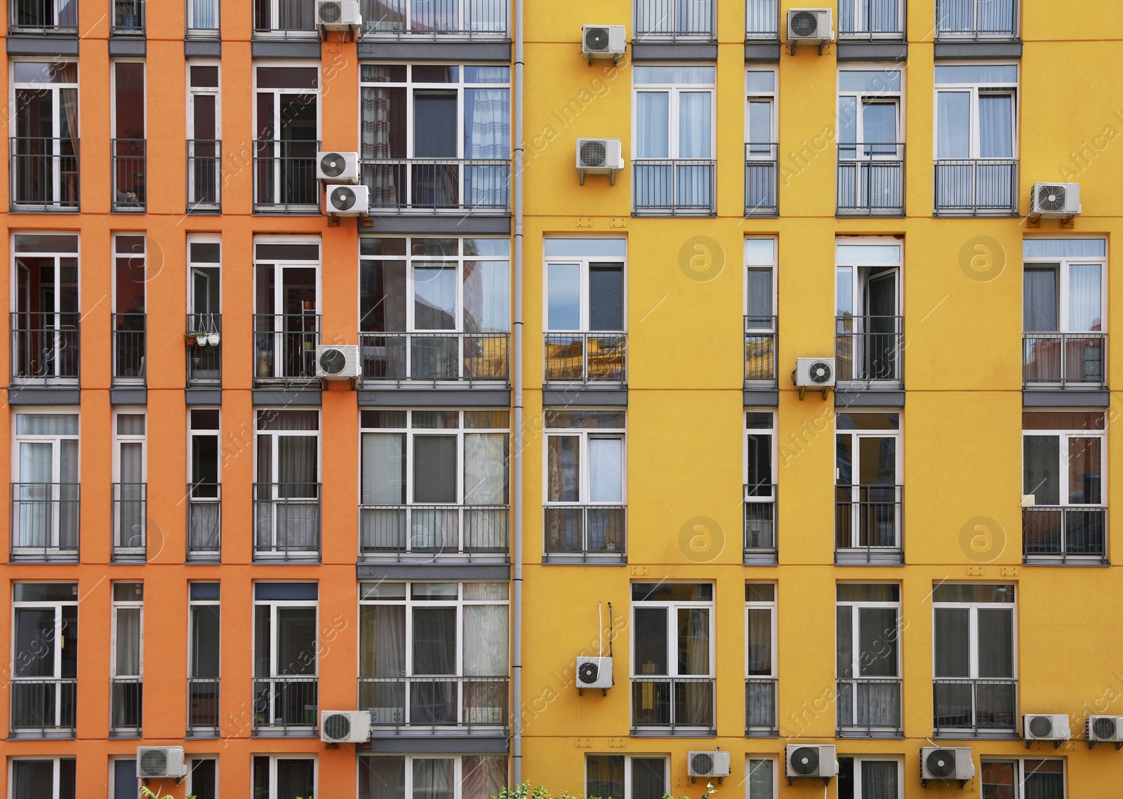 Photo of Colorful modern building with windows. Urban architecture
