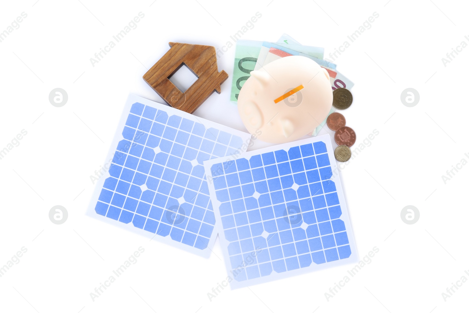 Photo of Composition with solar panels and piggy bank on white background, top view