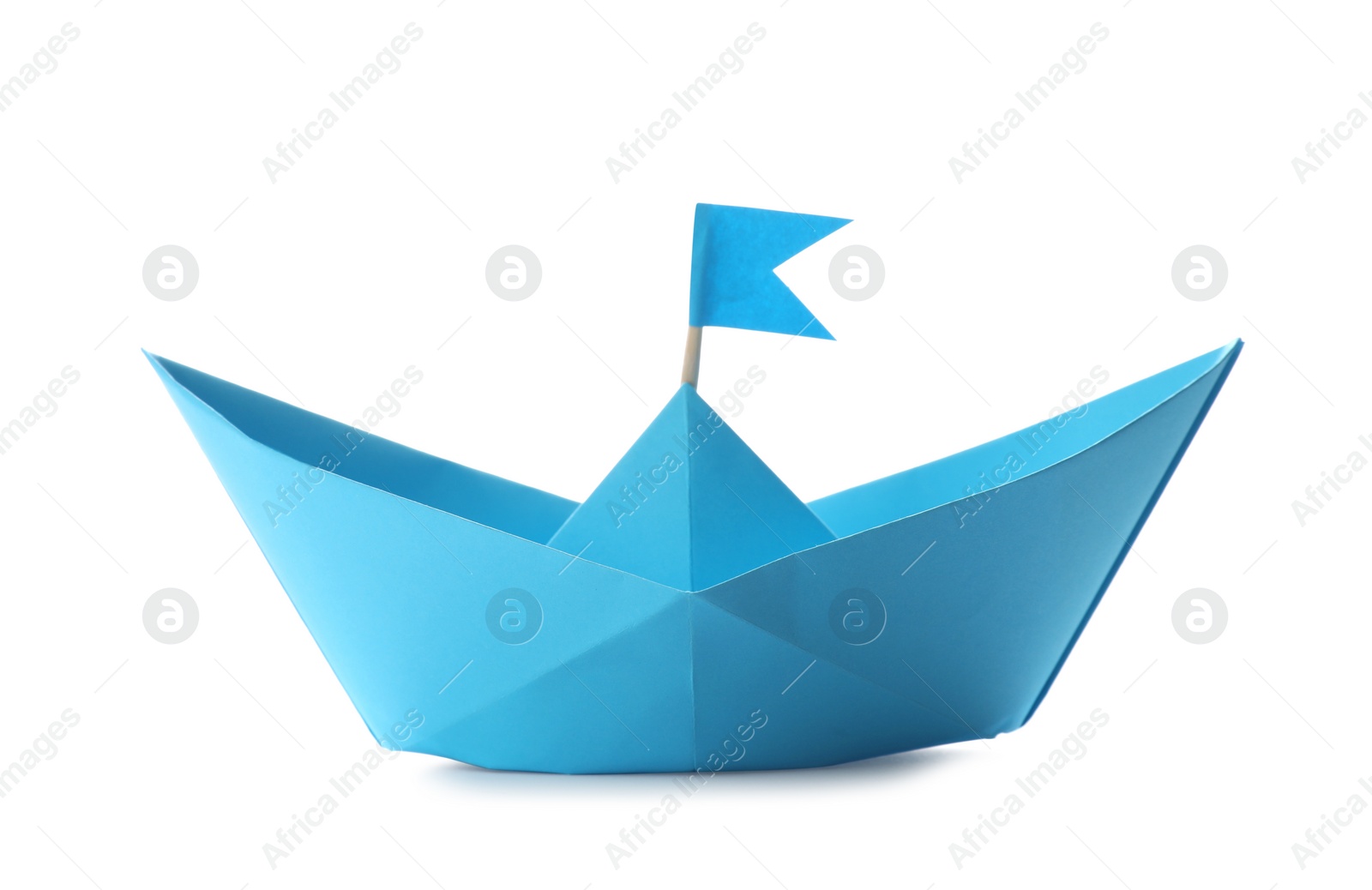 Photo of Handmade light blue paper boat with flag isolated on white. Origami art