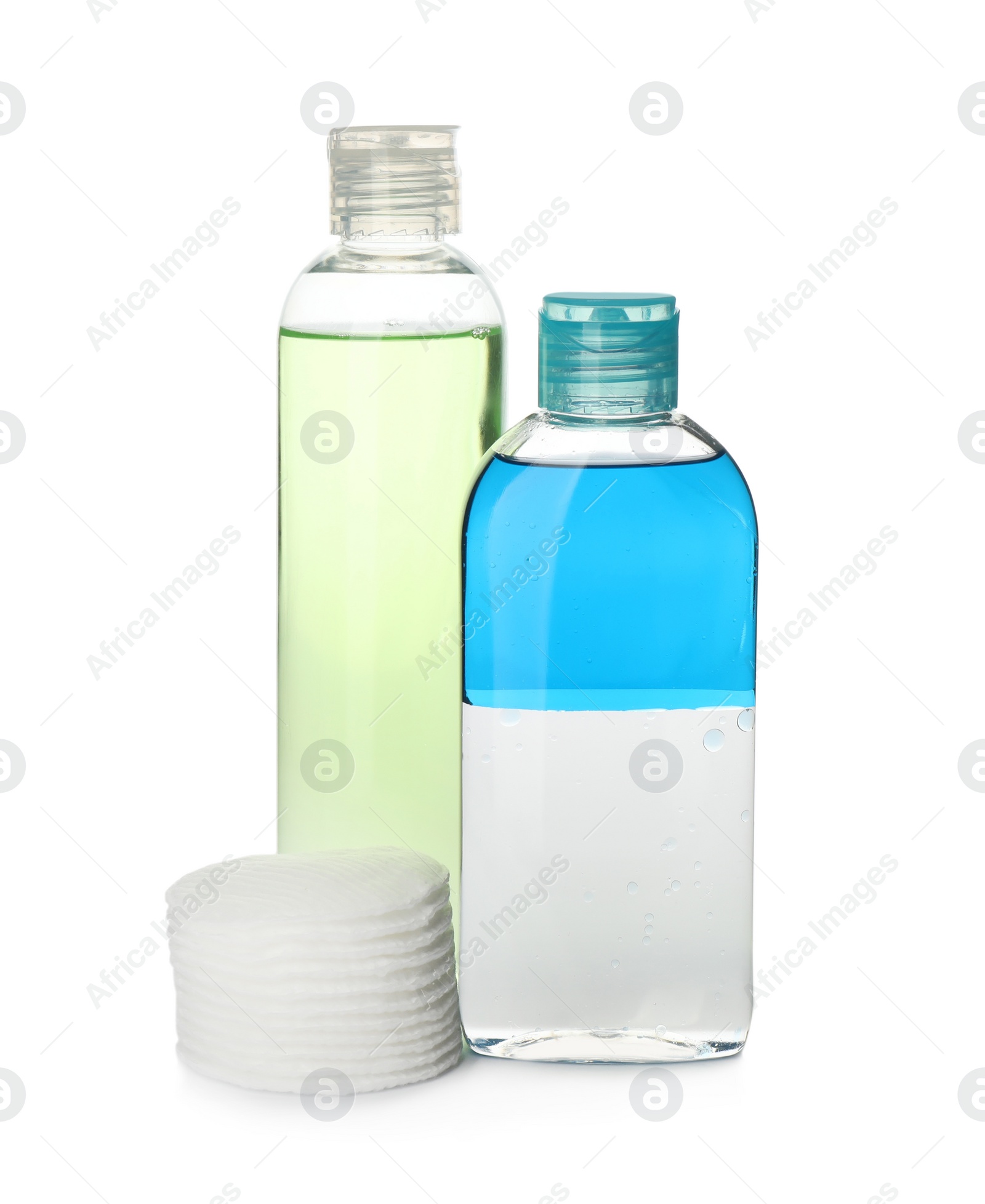 Photo of Cosmetic products and cotton pads for makeup removal on white background