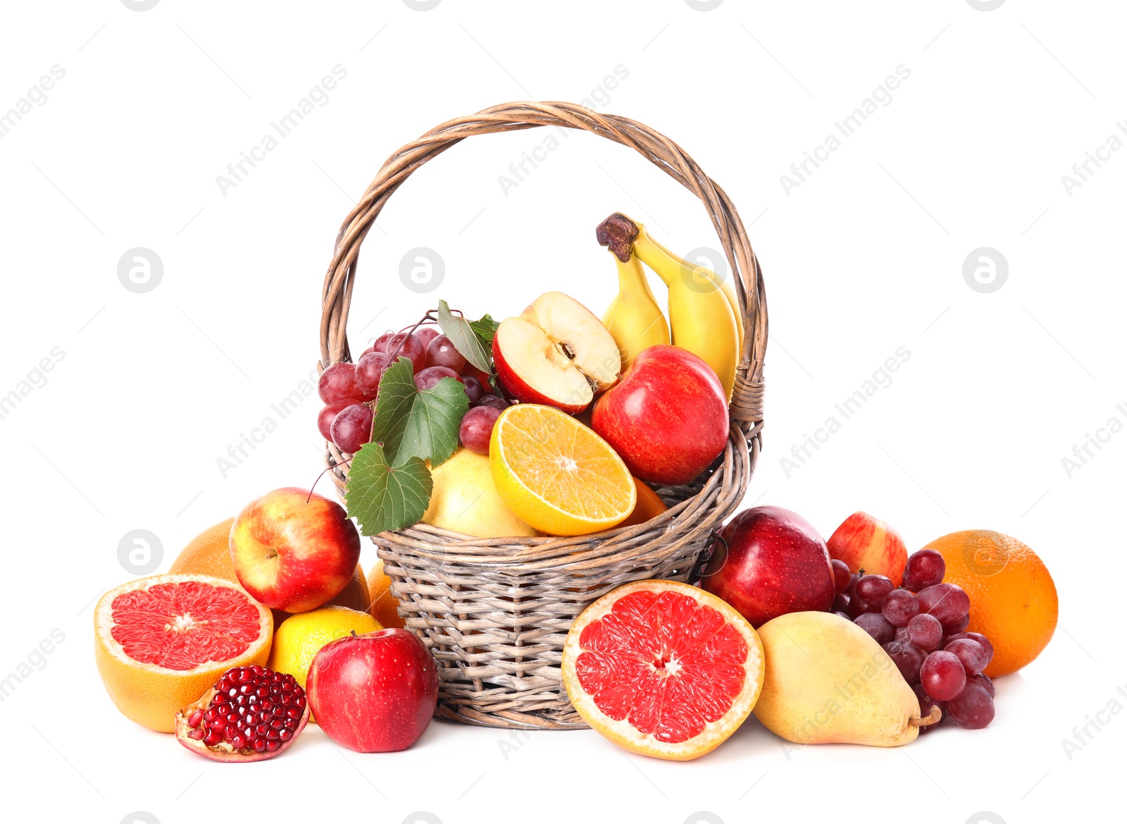 Photo of Wicker basket with different fruits on white background