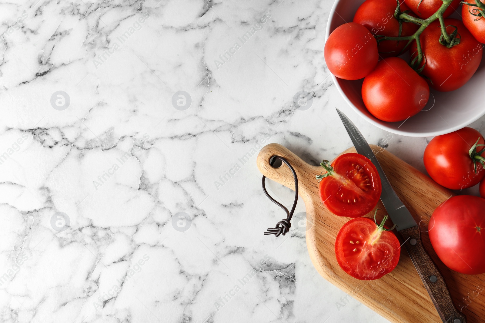 Photo of Flat lay composition with fresh ripe tomatoes on marble table. Space for text