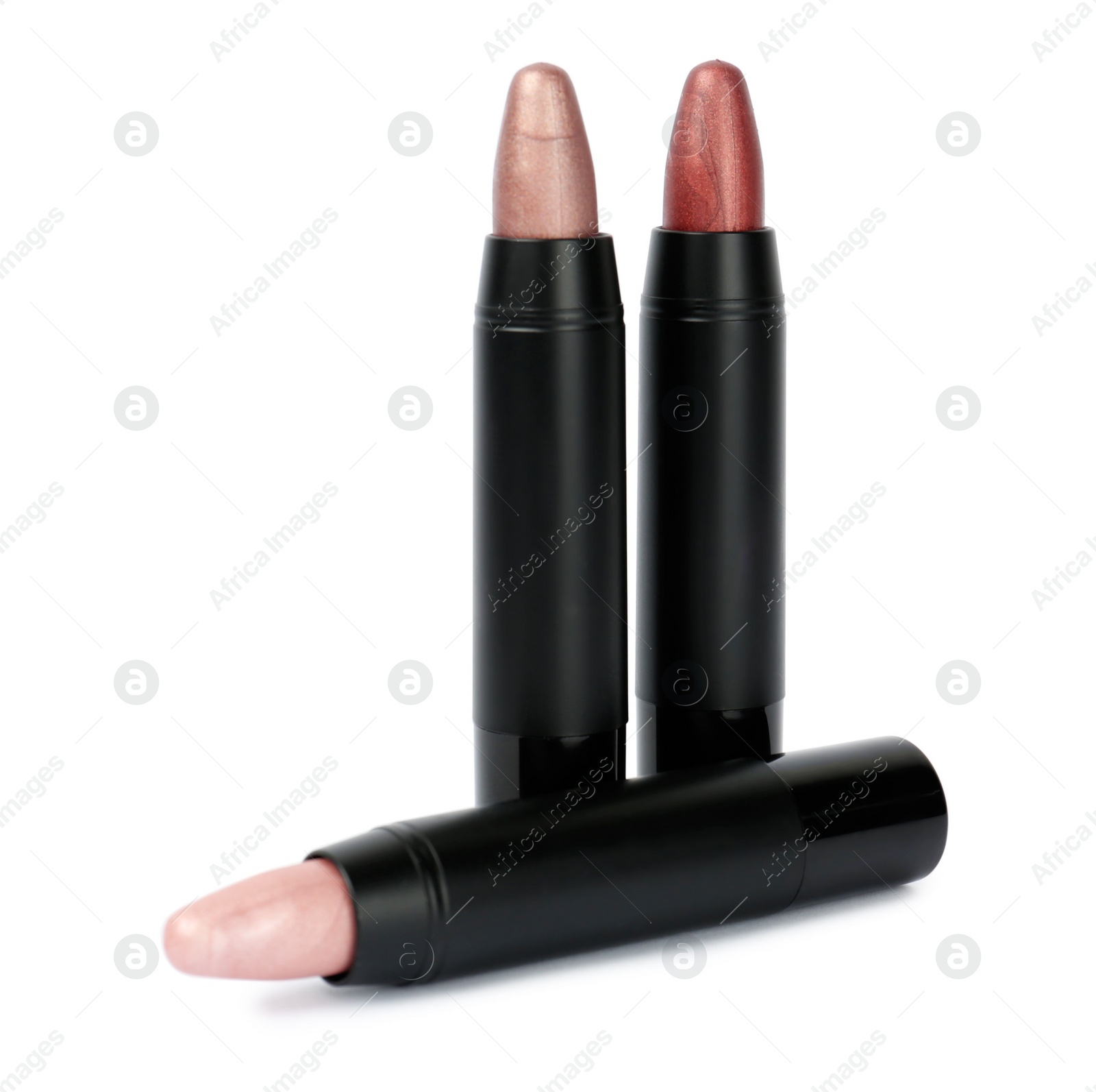 Photo of Colorful lipsticks in black tubes isolated on white