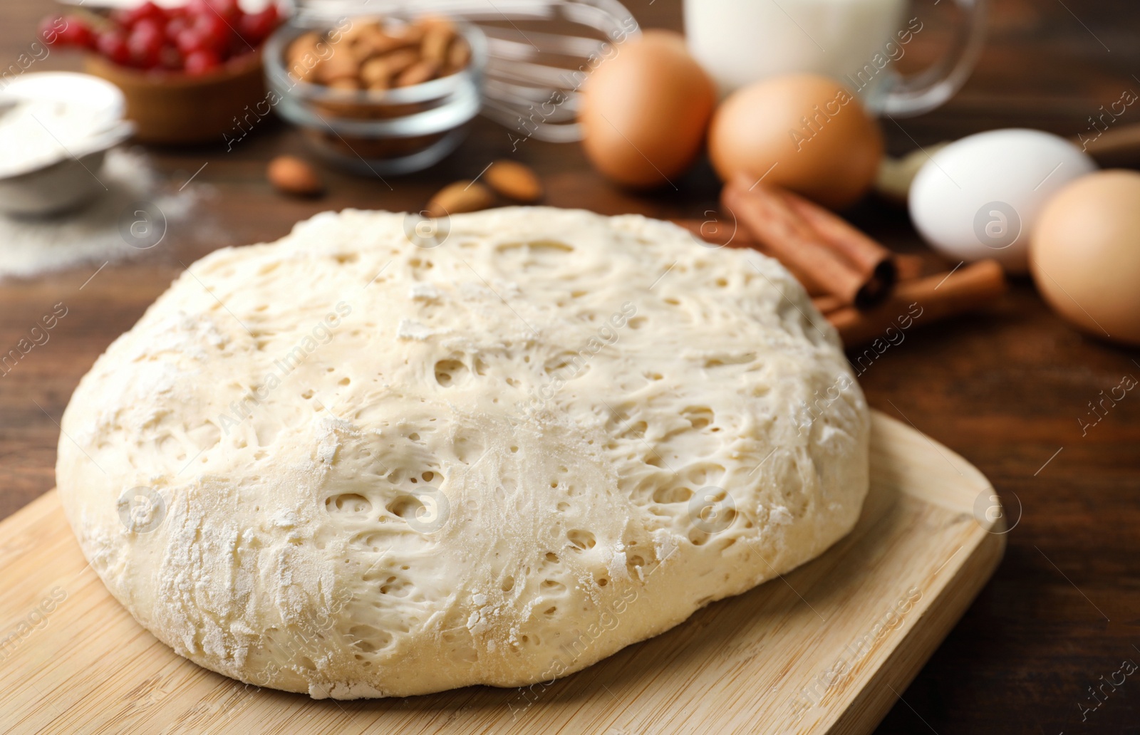 Photo of Board with wheat dough for pastries, closeup