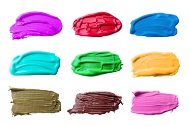 Image of Paint strokes of different colors on white background, top view