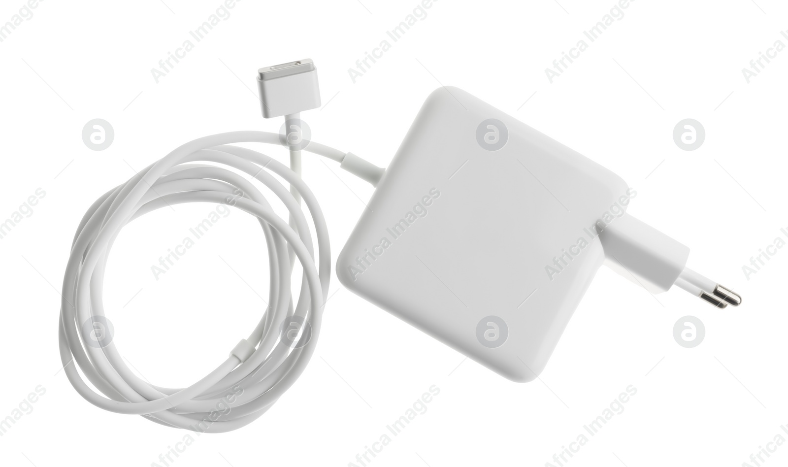 Photo of Laptop charger isolated on white, top view. Modern technology