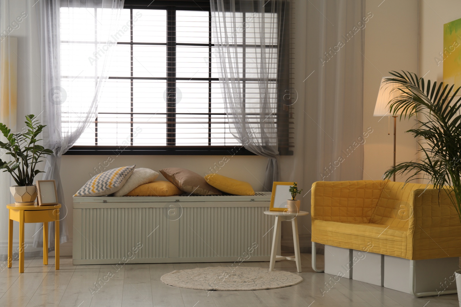 Photo of Stylish living room interior with modern furniture near window