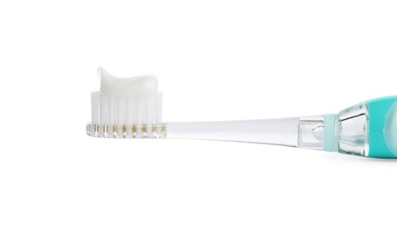 Electric toothbrush with paste on white background, closeup
