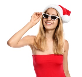 Photo of Young woman wearing Santa Claus hat on white background. Christmas vacation