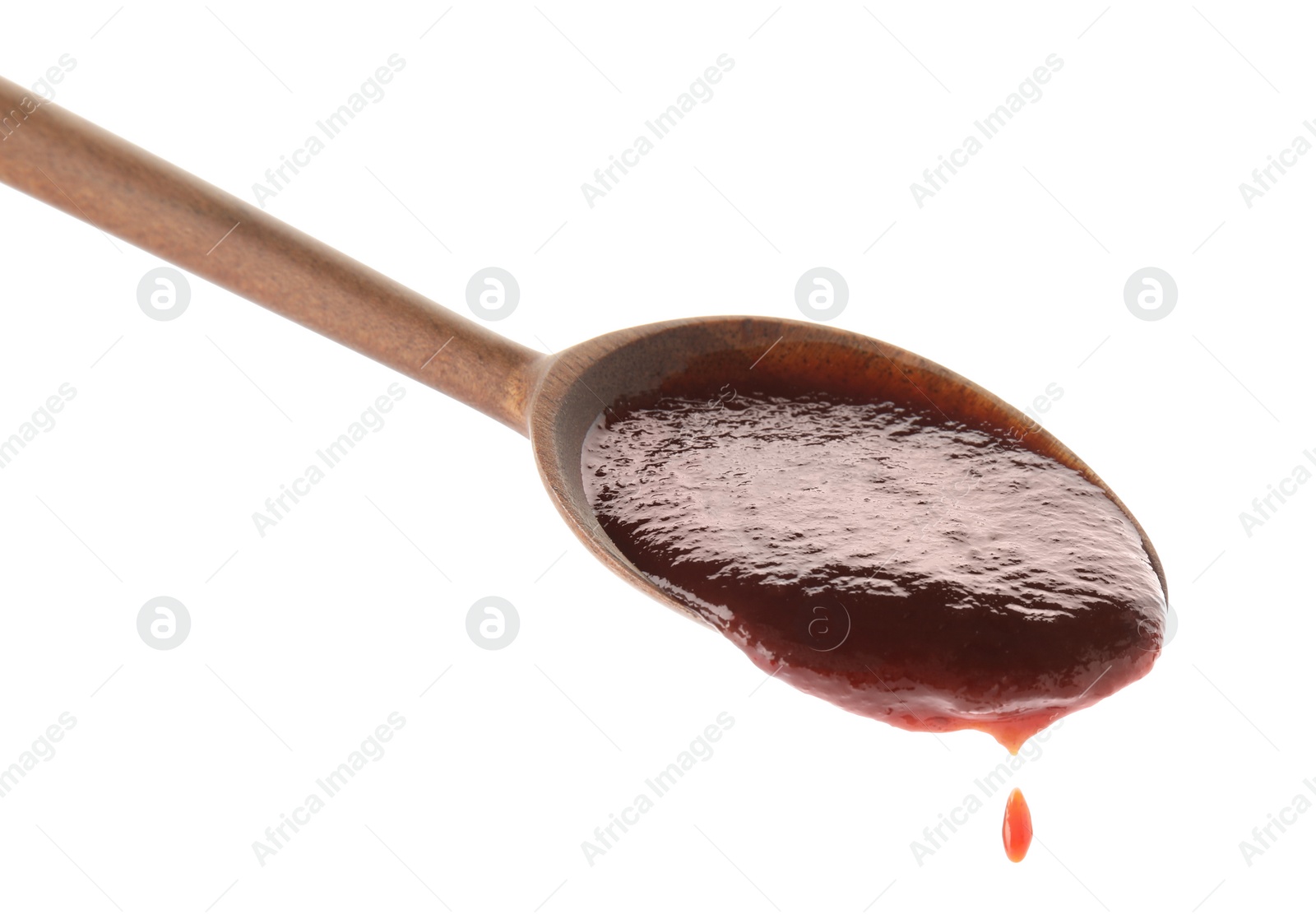 Photo of Spoon with hot barbecue sauce on white background