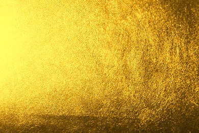 Image of Golden textured surface as background, closeup view