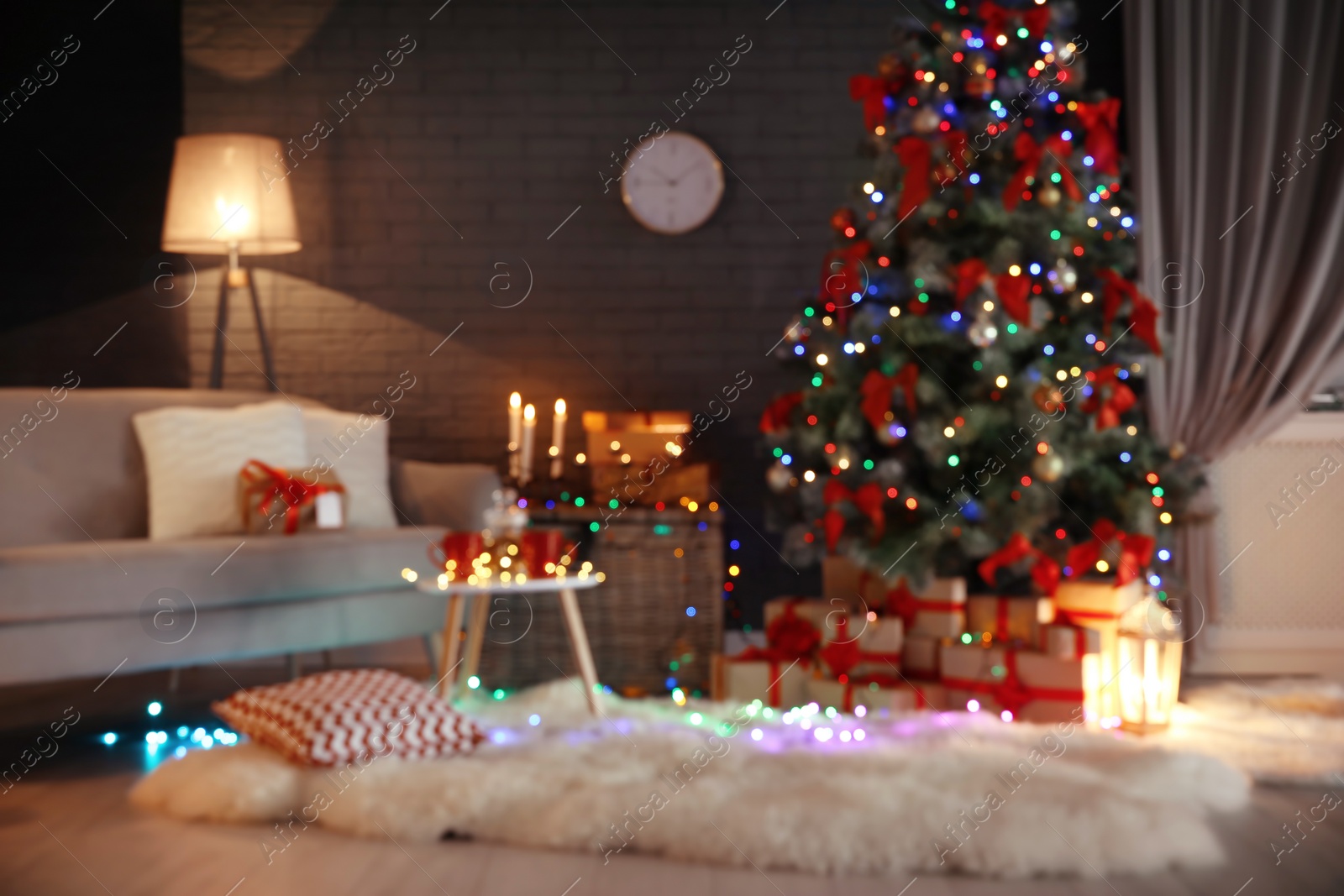 Photo of Blurred view of stylish room interior with decorated Christmas tree