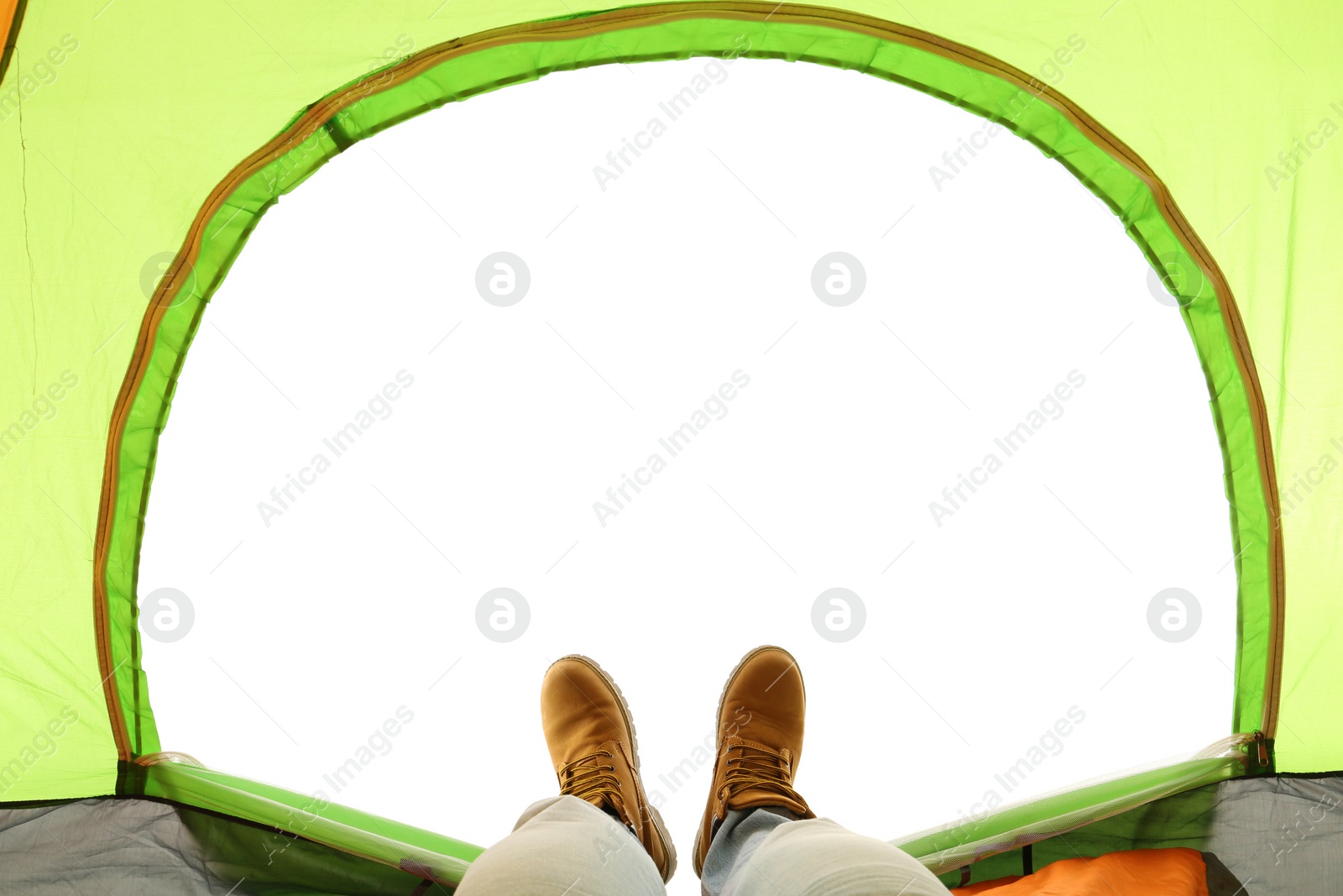 Photo of Closeup of man in camping tent on white background, view from inside