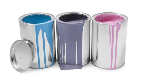 Photo of Cans of grey, light blue and pink paints isolated on white