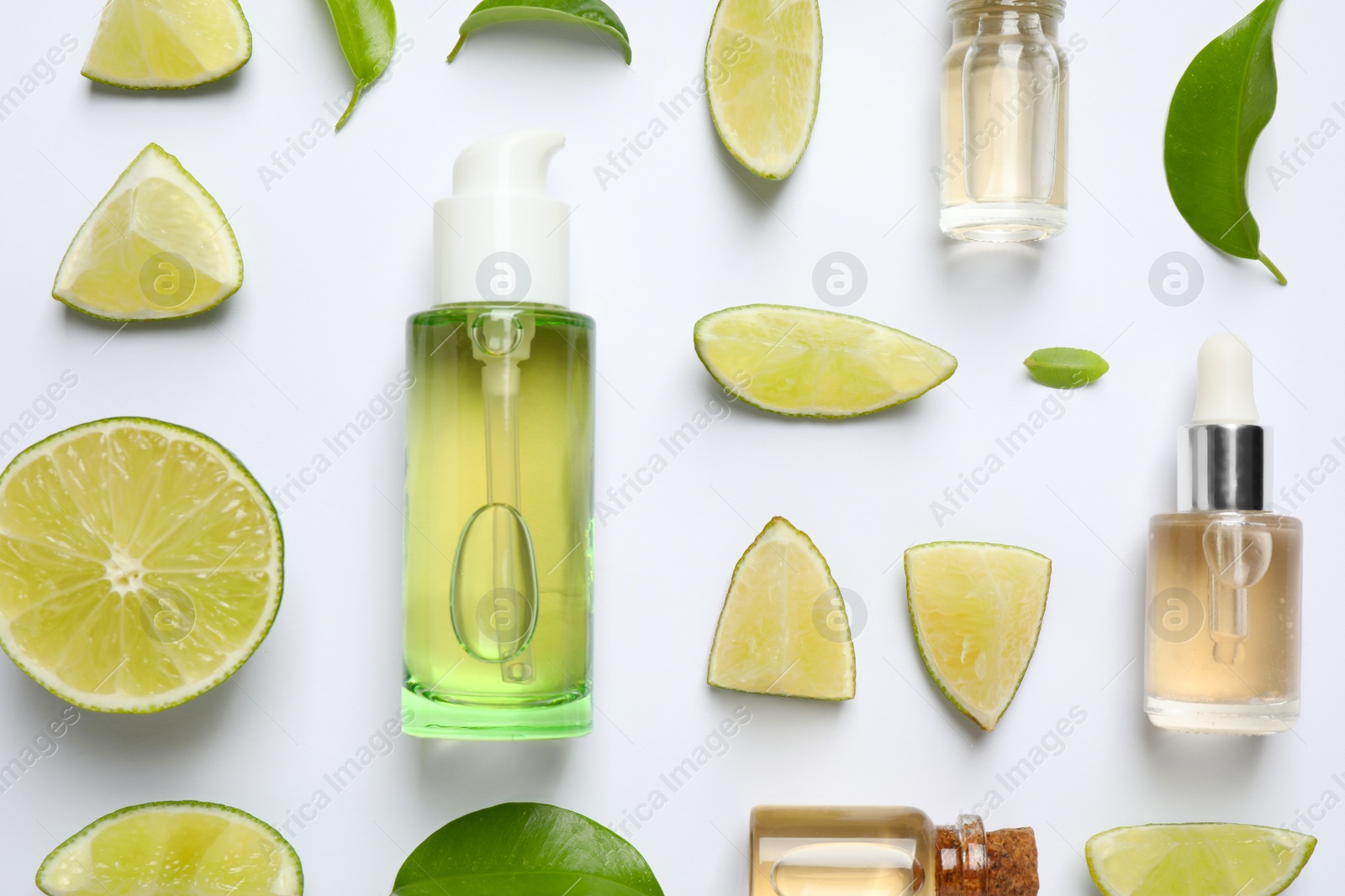 Photo of Composition with lime essential oil on white background, top view