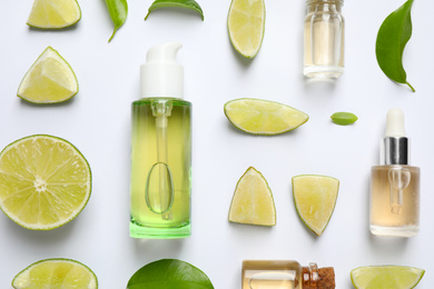 Composition with lime essential oil on white background, top view