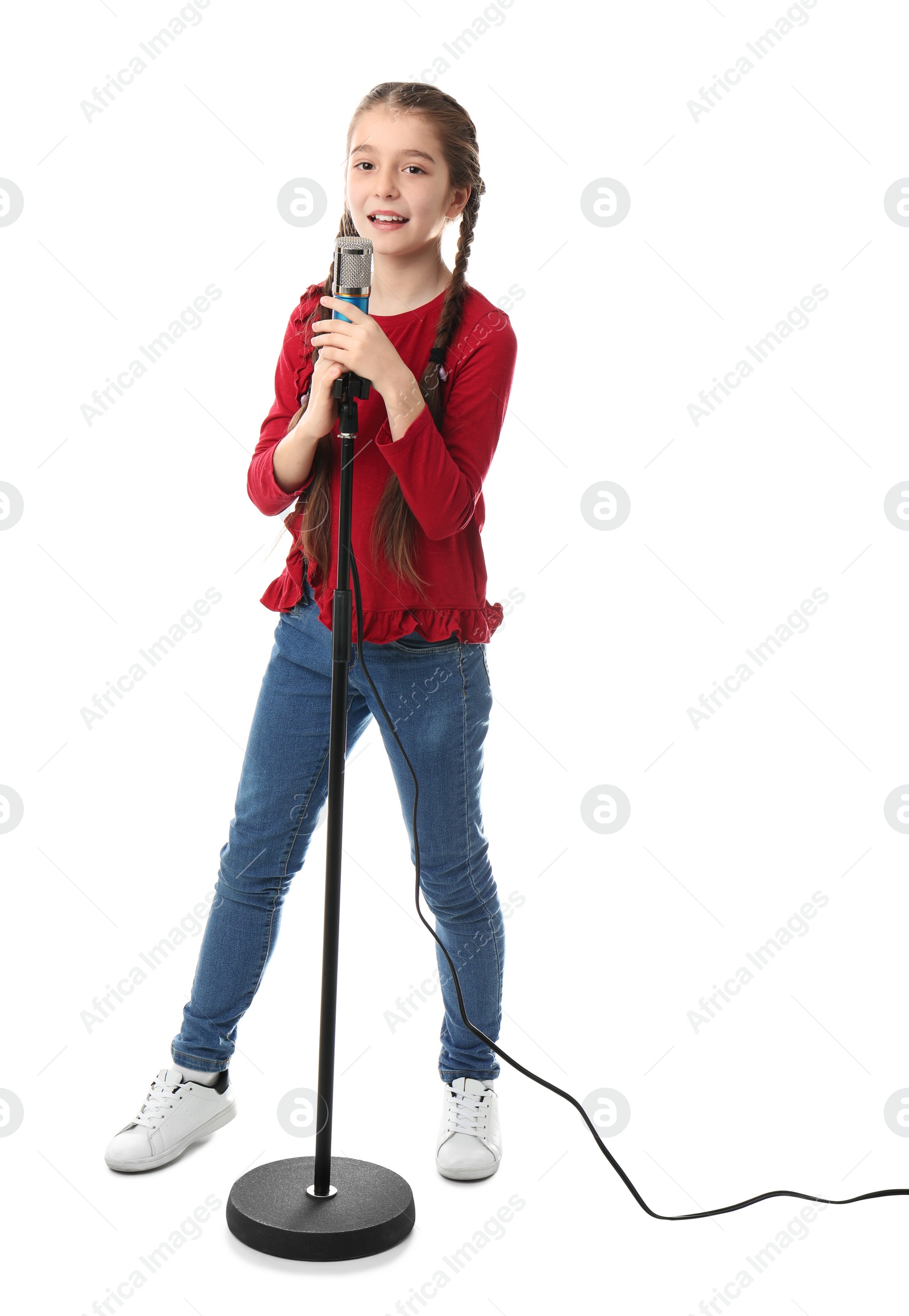 Photo of Cute girl with microphone on white background