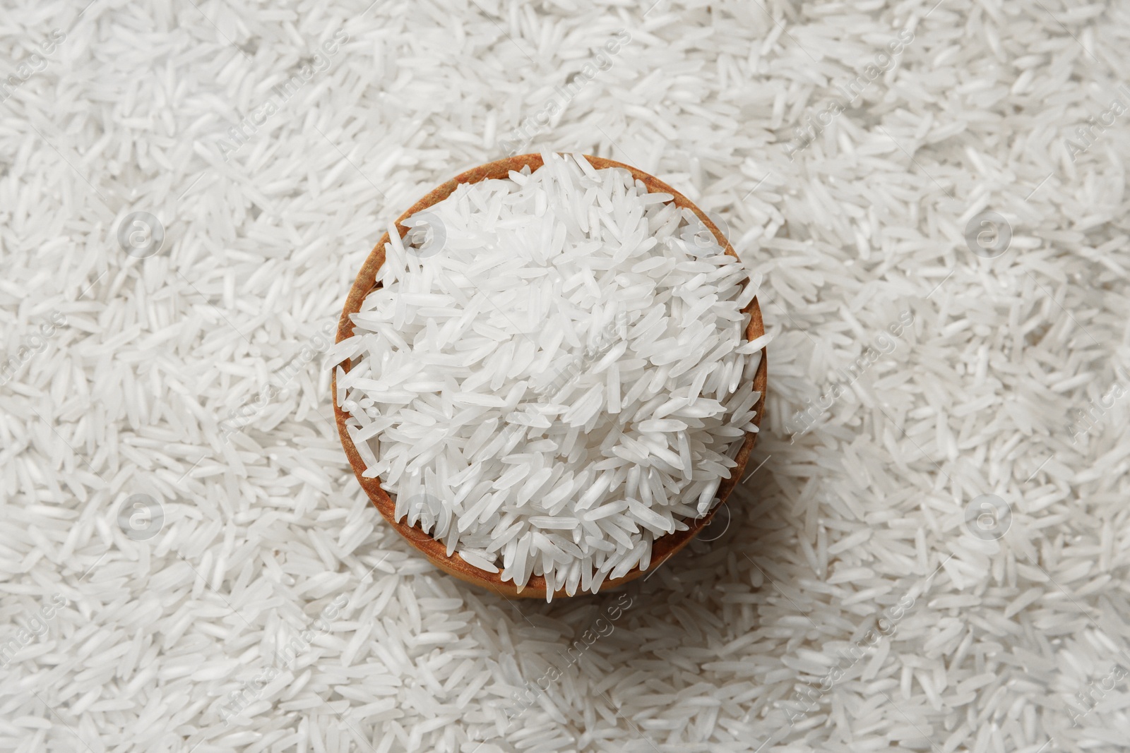 Photo of Raw basmati rice and bowl, top view