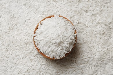 Photo of Raw basmati rice and bowl, top view