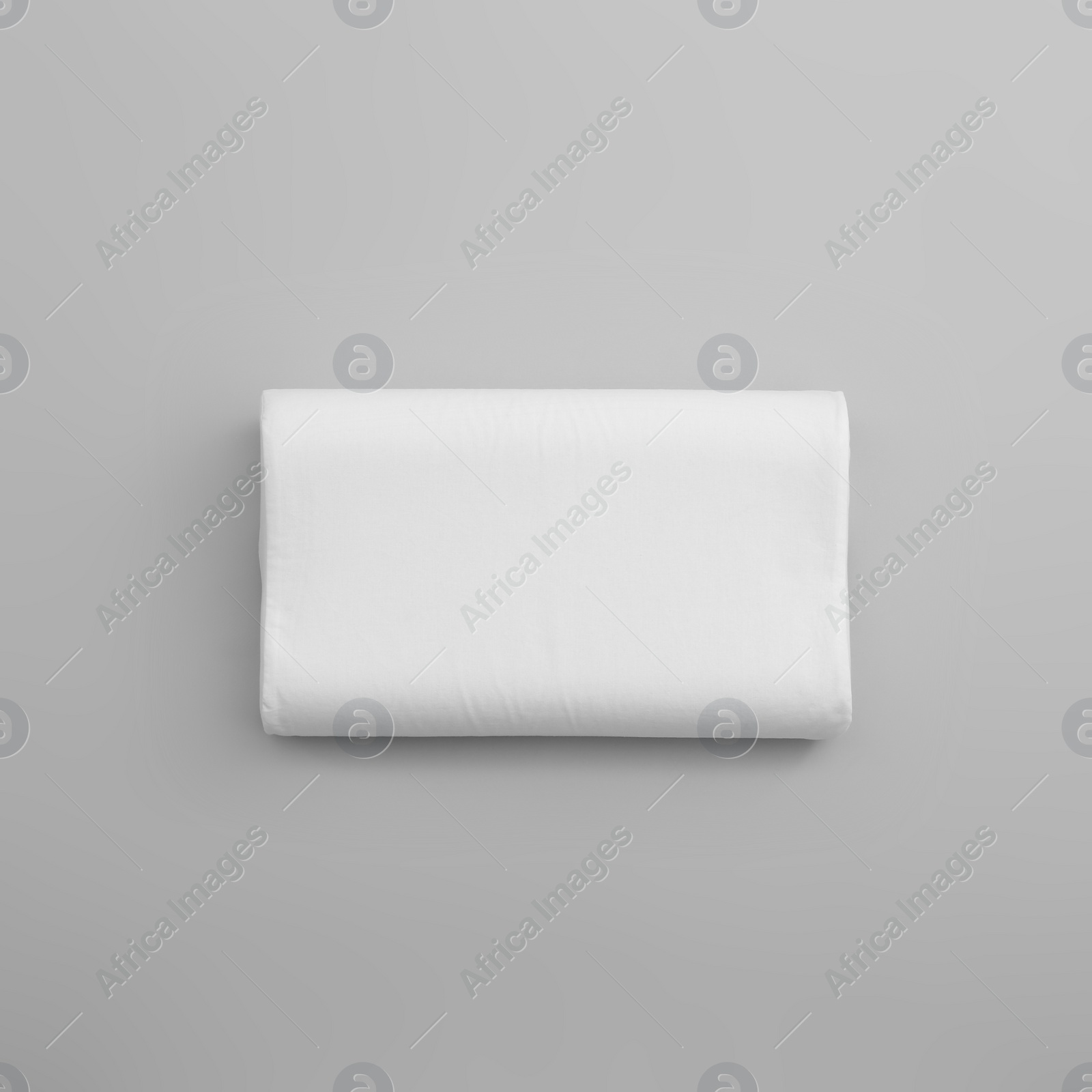 Photo of Clean soft orthopedic pillow on grey background, top view