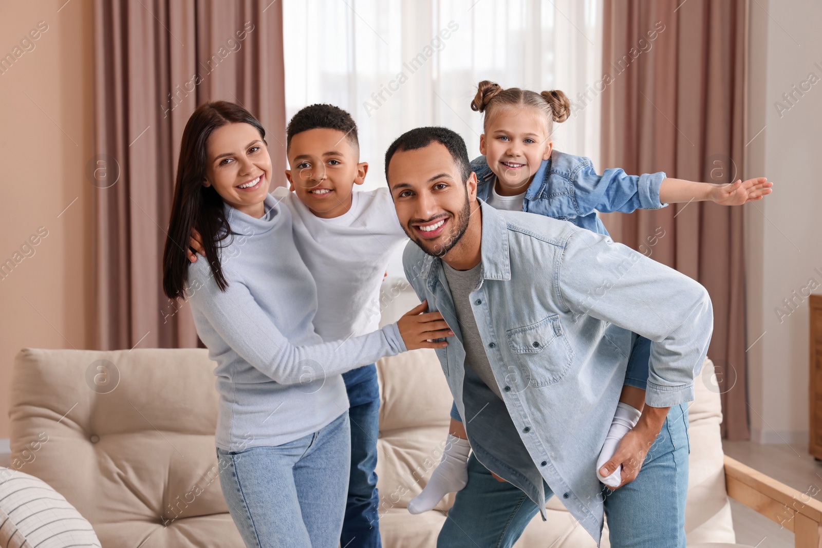 Photo of Happy international family spending time together at home