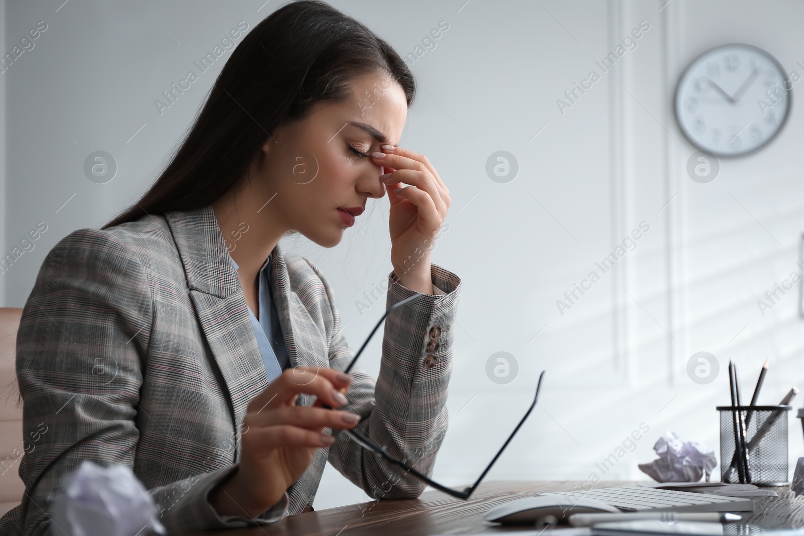 Photo of Businesswoman stressing out at workplace in office