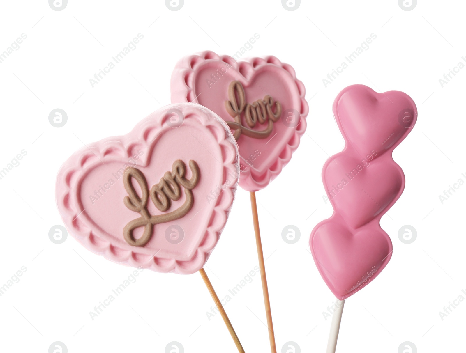 Photo of Heart shaped lollipops made of chocolate on white background