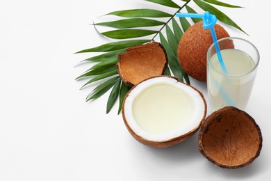 Photo of Composition with coconuts and drink on white background