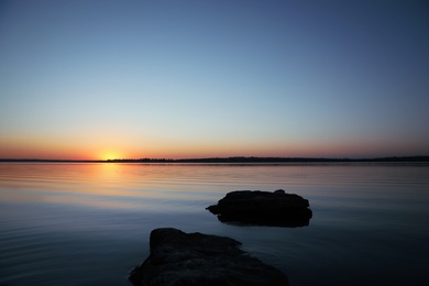 Photo of Picturesque view of sunset on riverside. Healing concept