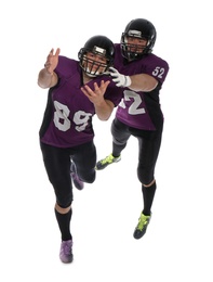 Men in uniform playing American football on white background