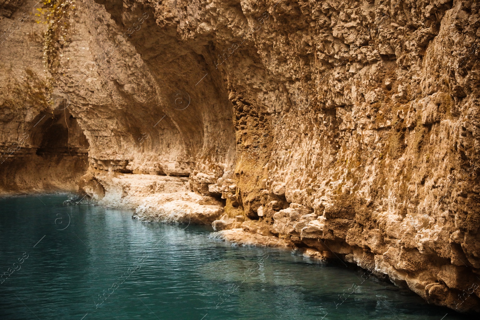 Photo of Picturesque view of clean river near cliffs outdoors