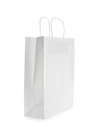 Photo of Blank paper bag isolated on white. Mockup for design