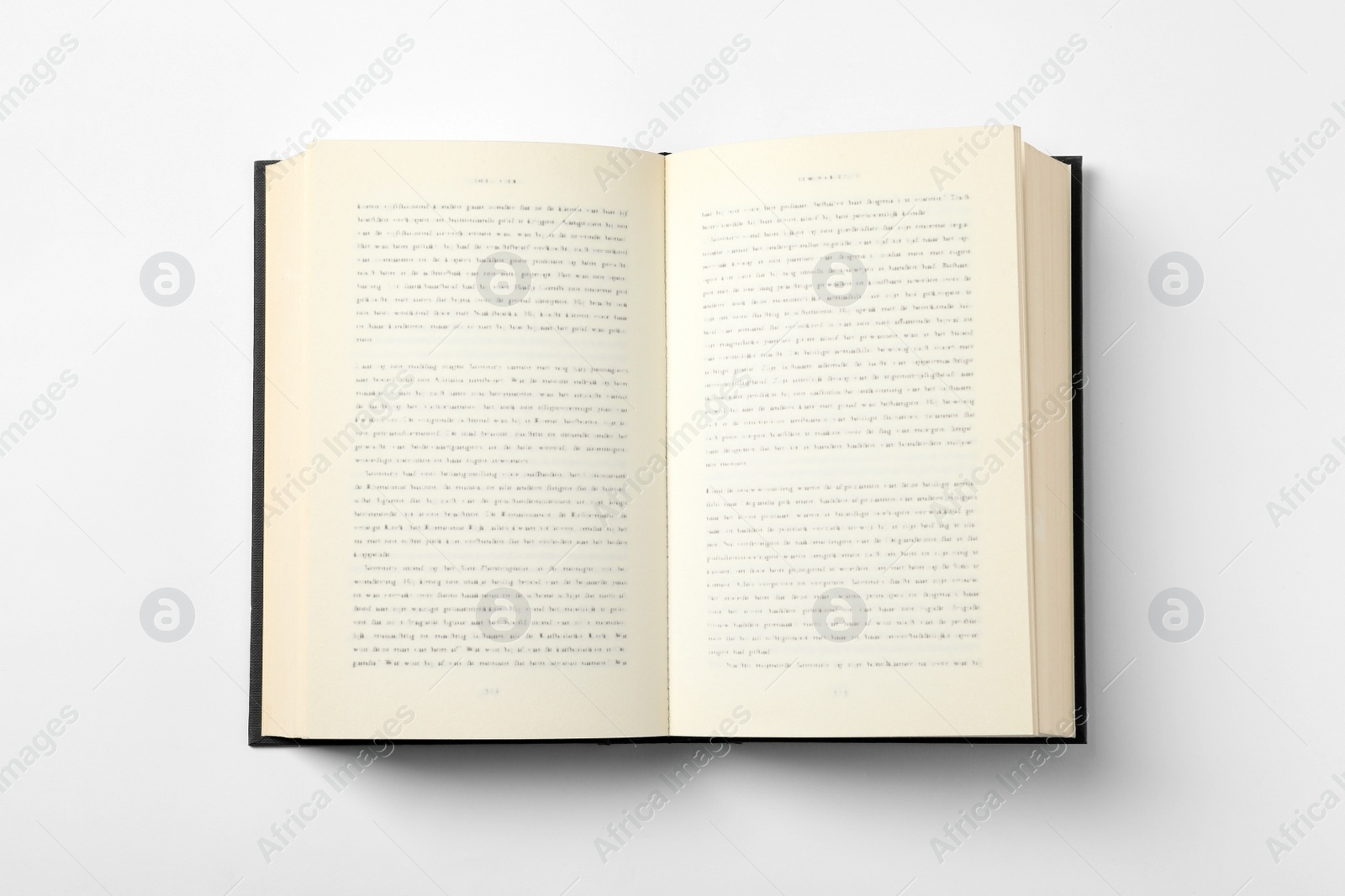 Photo of Open book on white background, top view