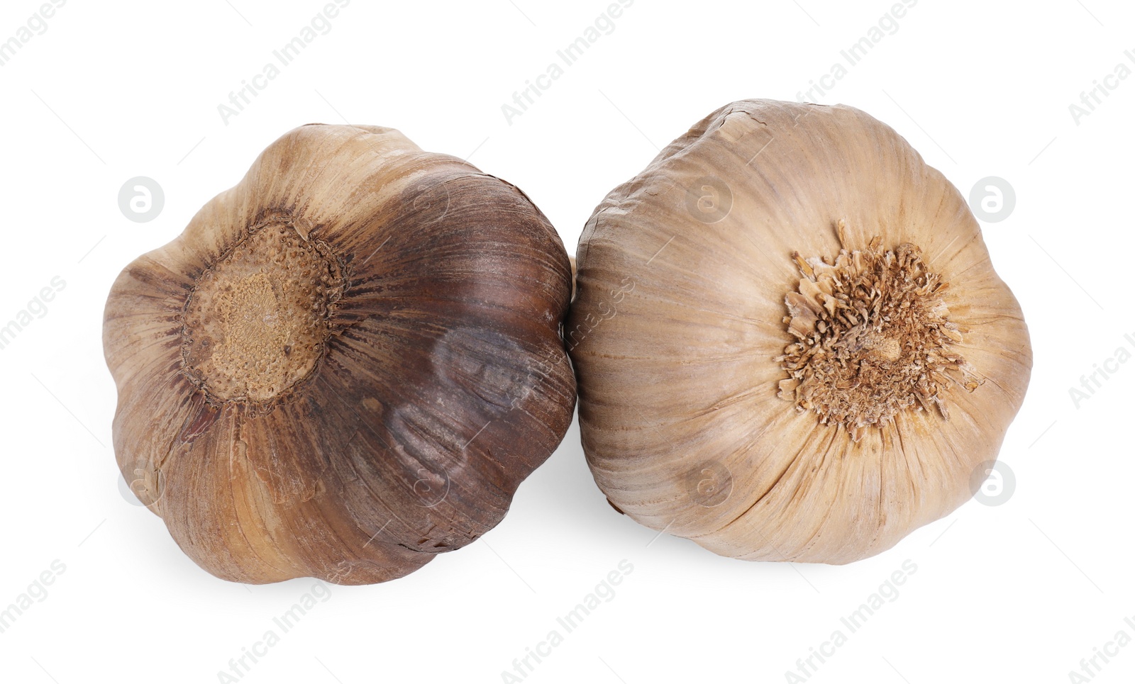 Photo of Bulbs of fermented black garlic isolated on white