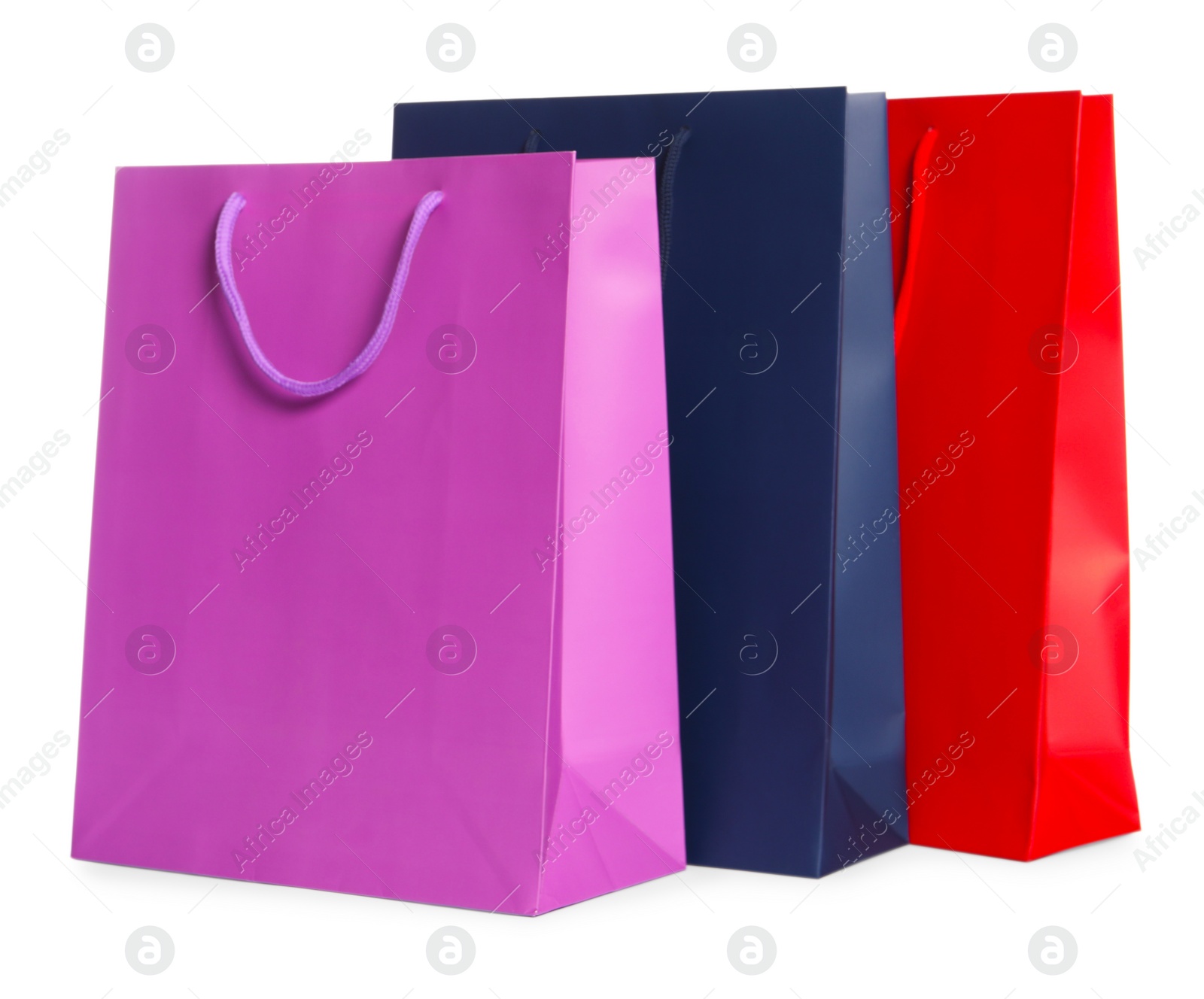 Photo of Colorful paper shopping bags isolated on white