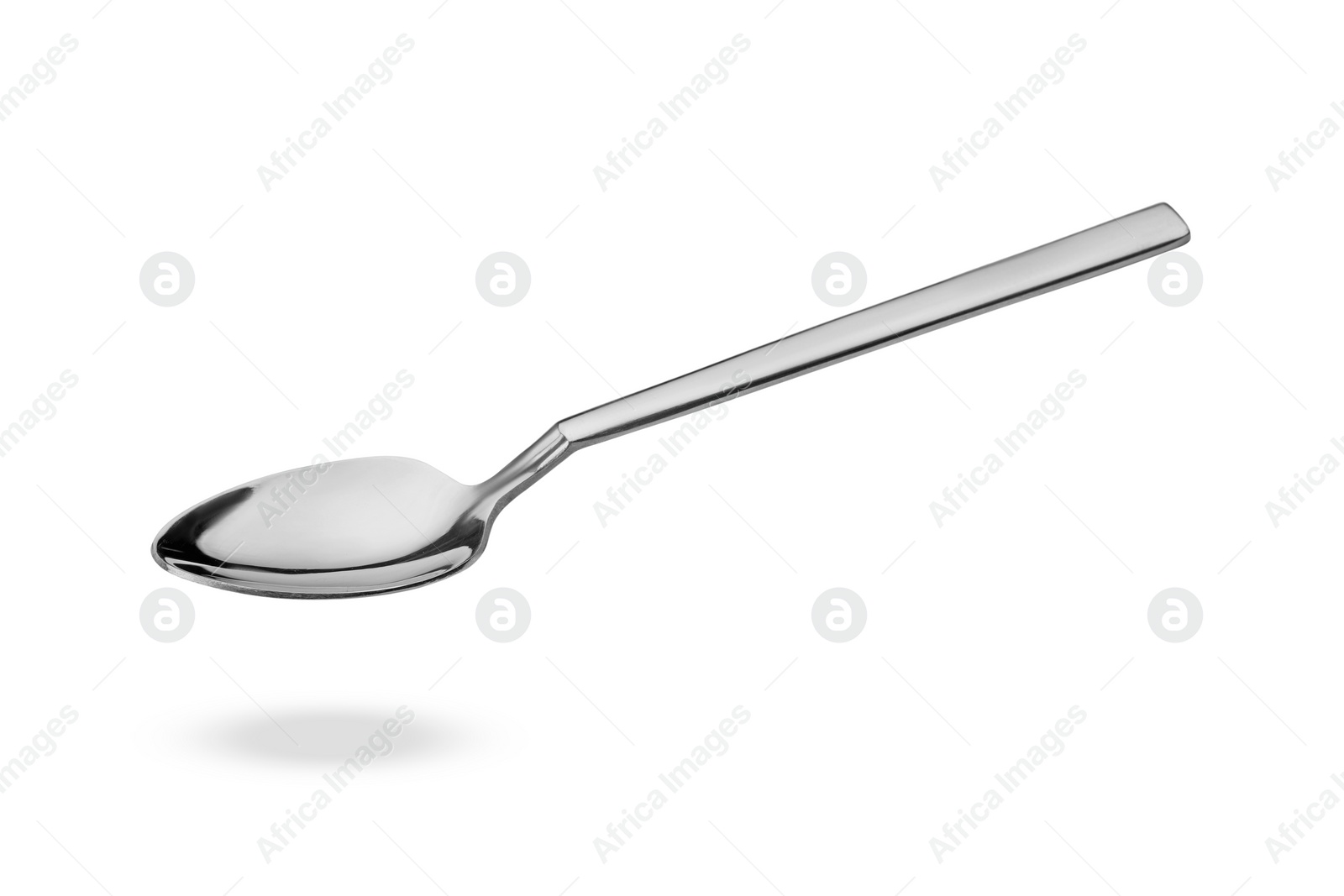 Image of Silver spoon in air isolated on white