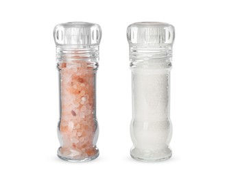 Image of Different salt in glass mill and shaker isolated on white