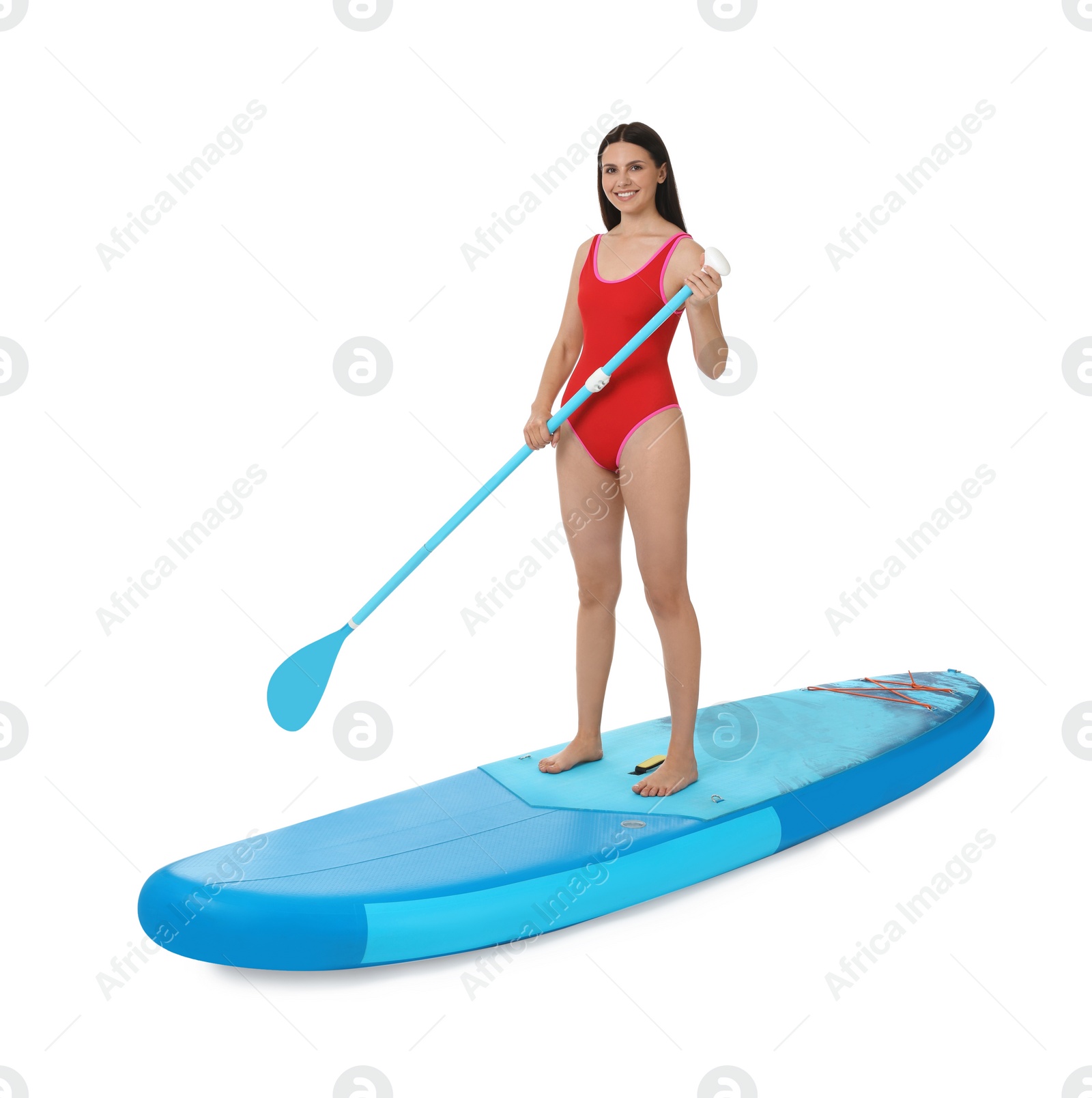 Photo of Happy woman with paddle on blue SUP board against white background