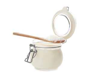 Photo of Jar and spoon with coconut oil on white background