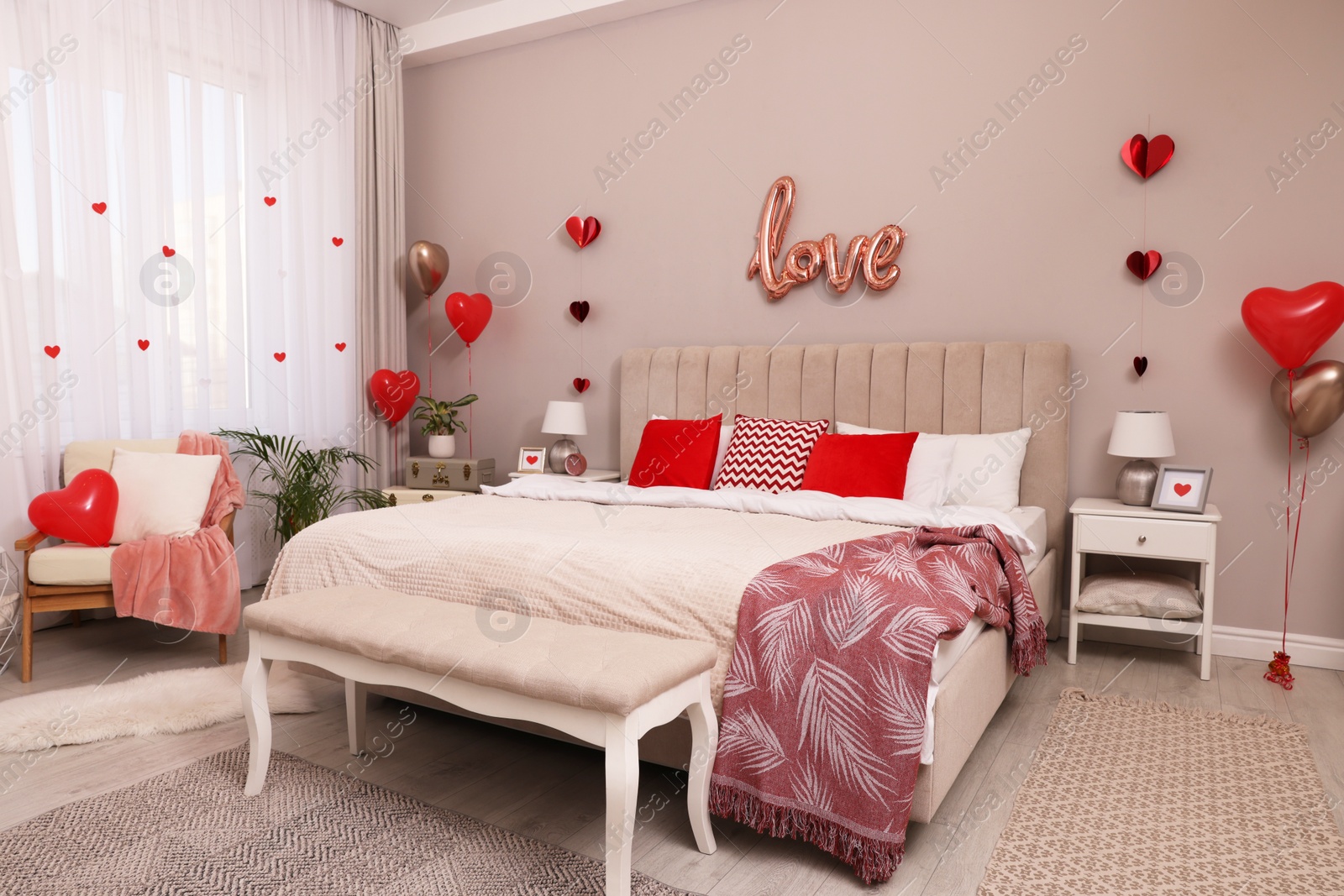 Photo of Cozy bedroom decorated for Valentine Day. Interior design