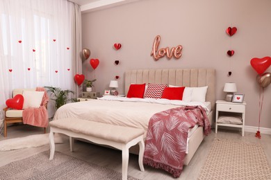 Photo of Cozy bedroom decorated for Valentine Day. Interior design