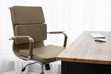 Modern office chair in stylish workplace interior