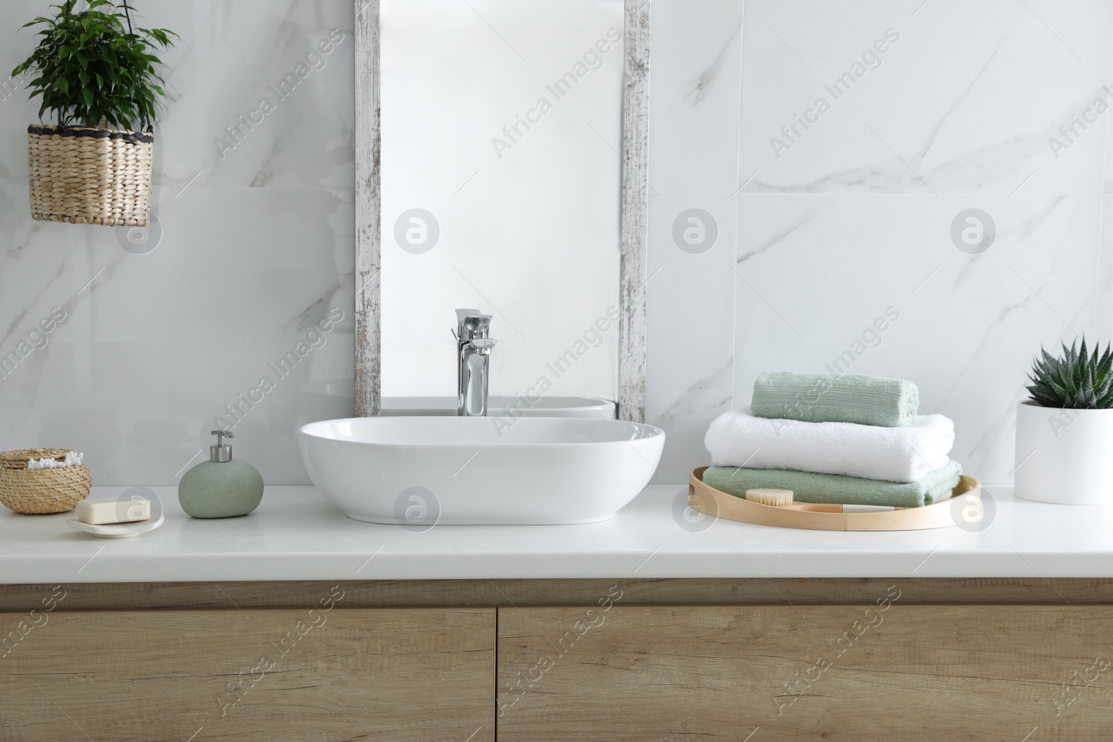 Photo of Modern bathroom interior with stylish mirror and vessel sink