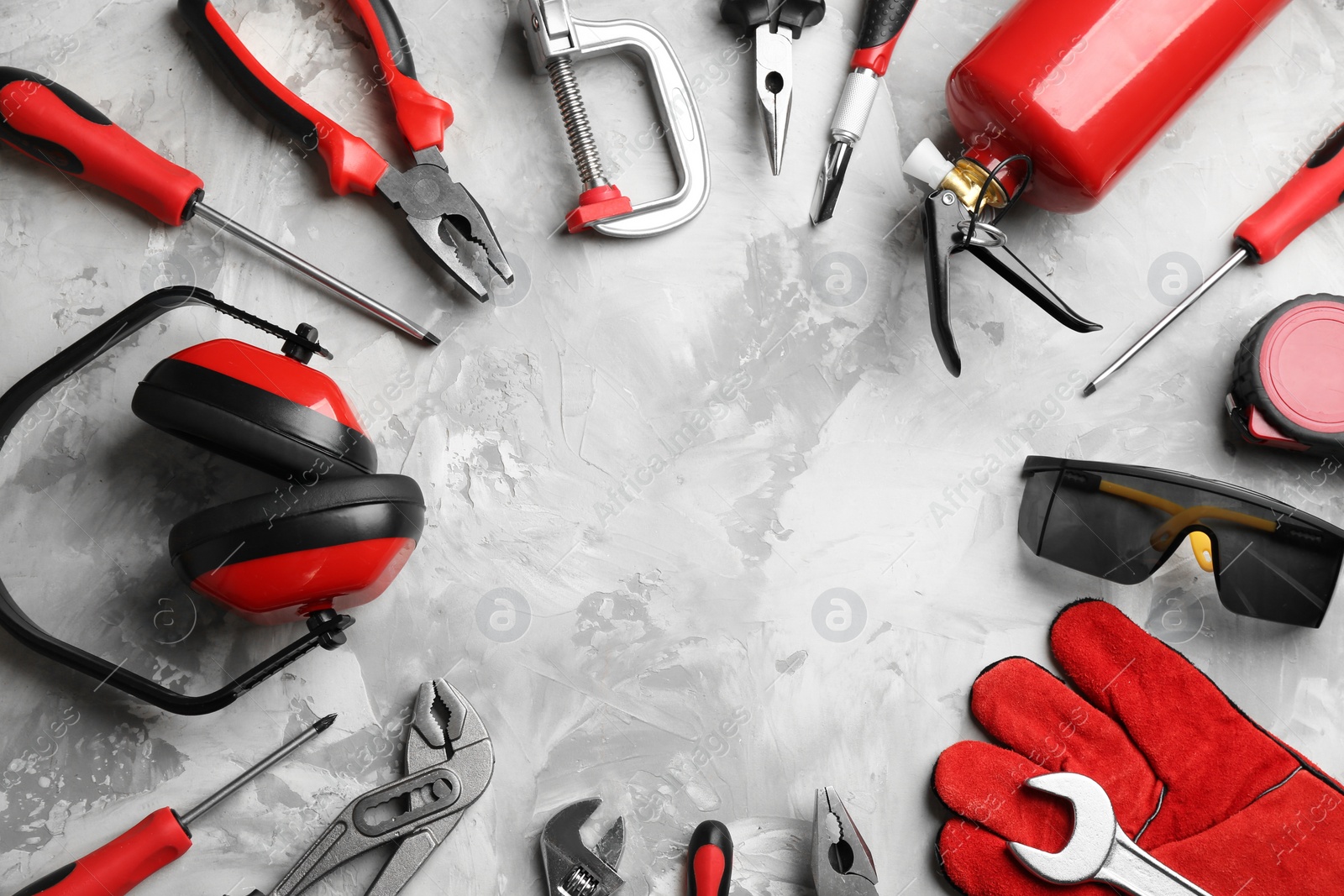 Photo of Flat lay composition with construction tools on grey background, space for text