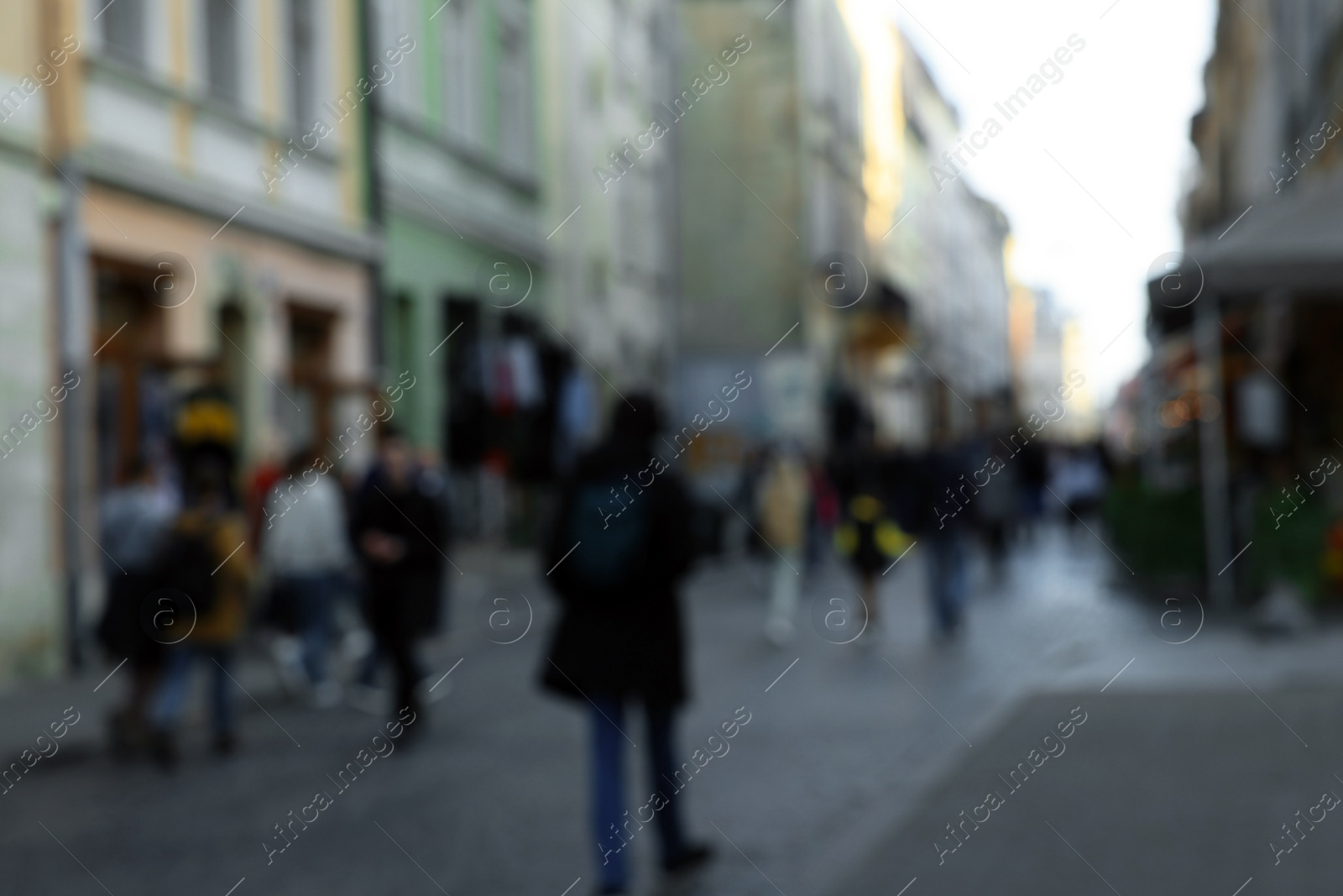 Photo of Blurred view of people walking on city street