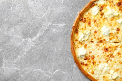 Photo of Delicious cheese pizza on grey background, top view