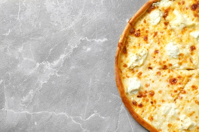 Delicious cheese pizza on grey background, top view