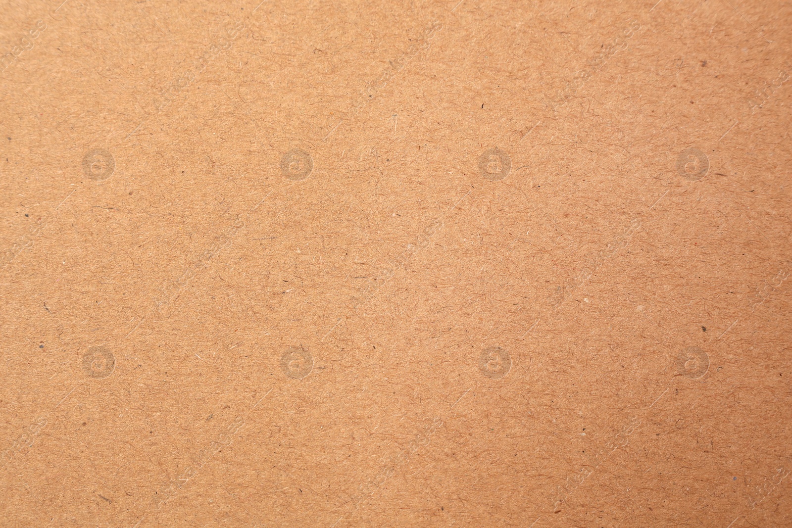 Photo of Texture of beige paper sheet as background, closeup