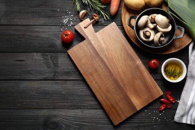Photo of Flat lay composition with fresh products on black wooden table, space for text. Healthy cooking