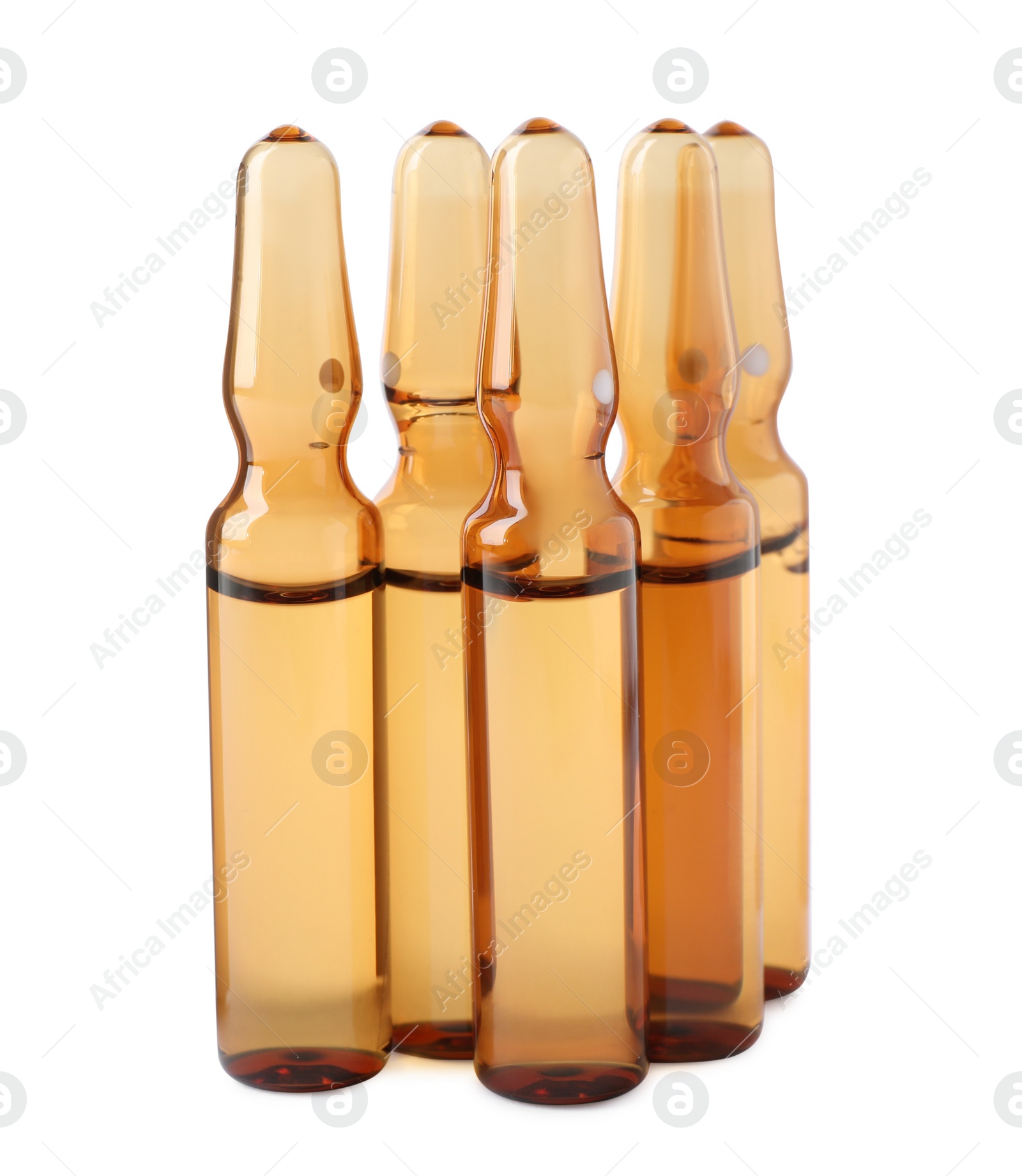 Photo of Brown pharmaceutical ampoules with medication on white background